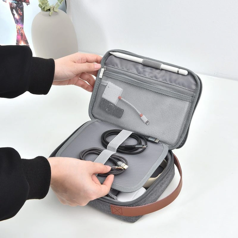 WiWU Minimal Tech Pouch – Ultimate organization for your gadgets, offering sleek storage for cables, chargers, power banks, earphones, and more with a minimalist design and durable, water-resistant fabric.
