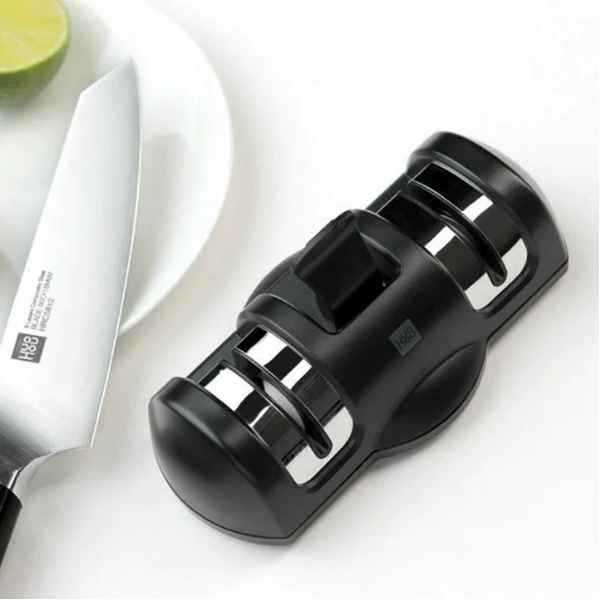 Xiaomi Huohou 2-Stage Professional Kitchen Knife Sharpener Key Features: 2-stage knife sharpening system Diamond rough grinding wheel Ceramic fine grinding wheel Double-sided sharpening design Suction-fixing base for stability One-handed operation Stainless steel decoration plate Compact and easy-to-store design Model: HU0045